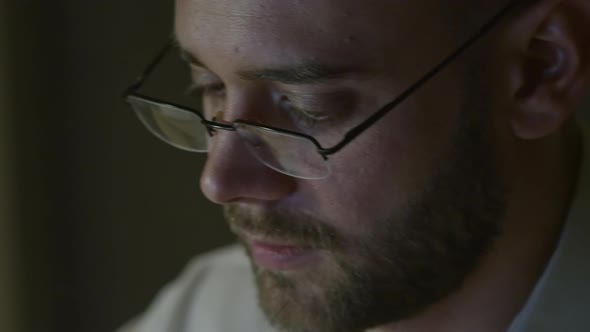 Handsome Man Working on Computer at Night