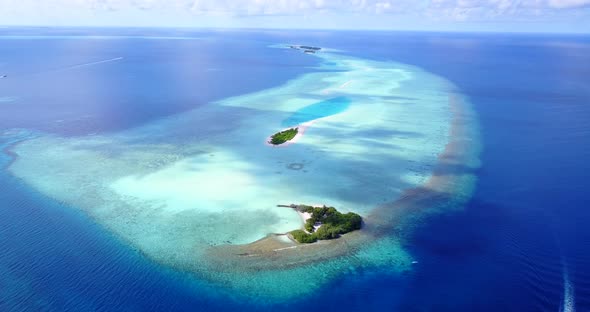 Daytime fly over abstract view of a paradise sunny white sand beach and blue ocean background in col