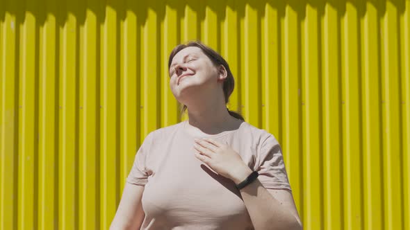 Woman Enjoys Bright Sunshine Warmth