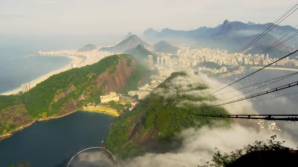 Slow pan of Brazilian coastline on a misty morning in Rio de Janeiro, Brazil