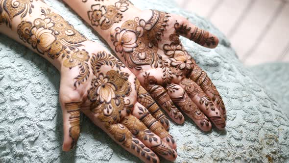 Women Applying Henna on Hand