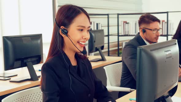 Business People Wearing Headset Working in Office