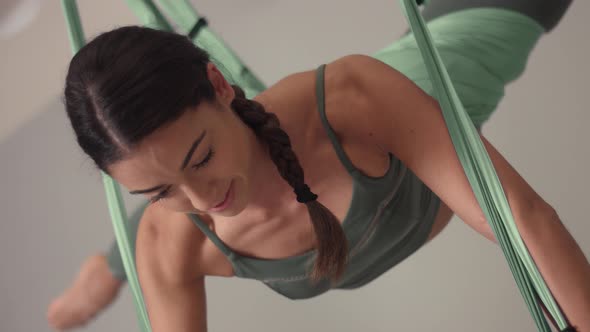 Adorable Woman Yoga Trainer During Aerial Yoga Master Class 