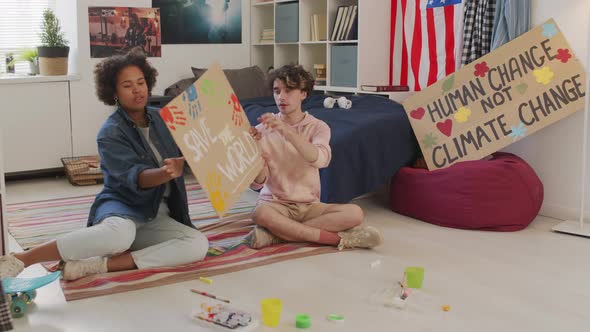 Activists Posing with Slogan Sign in Room