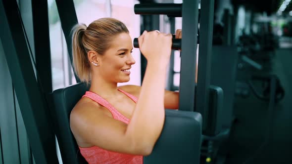 Beautiful Woman Doing Chest Exercises