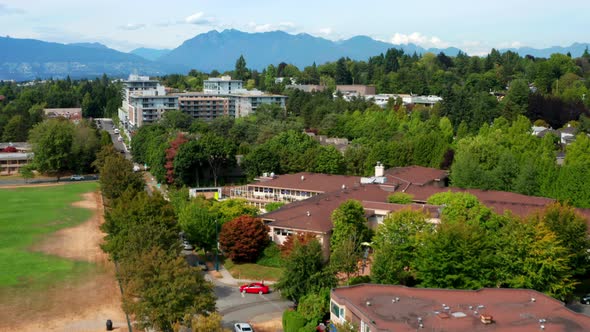 Empty Playground Park In Arbutus Ridge Near Neighbourhood In Canada With Downtown Vancouver Building