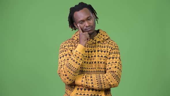 Young Handsome African Man Thinking While Looking Down