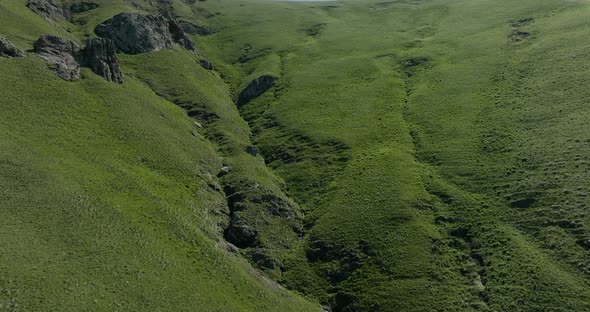 AERIAL - A ravine in the Caucasus Mountains, Georgia, rising forward shot