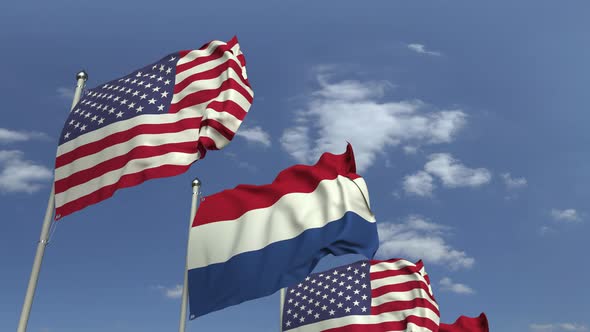 Flags of the Netherlands and the USA Against Sky