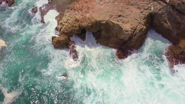 Tropical waves crashing against ocean rocks at Manuel Antonio National Park, Costa Rica