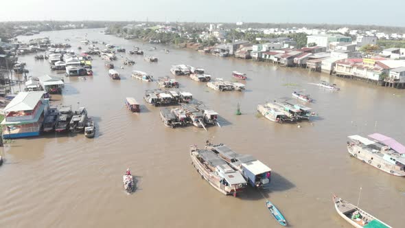 Aerial: rotating panorama over Cai Rang floating market Can Tho Vietnam