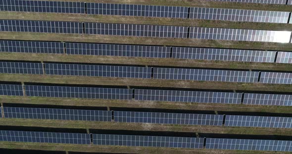 4K Aerial footage of photostatic solar farm. Solar farm power station from above