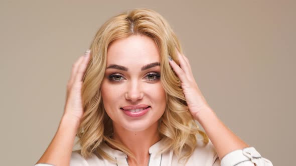 Beautiful Caucasian Woman Posing for Photographer in Studio