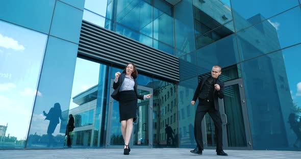 Two Young Student Friends, Couple of Successful Business Persons, Woman and Man Dancer Dancing