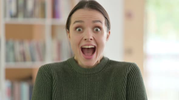 Portrait of Excited Young Woman Celebrating Success