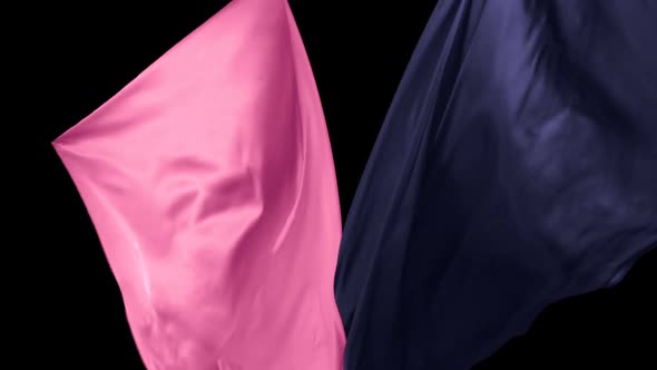 Blue and pink fabric flowing on black background, Slow Motion