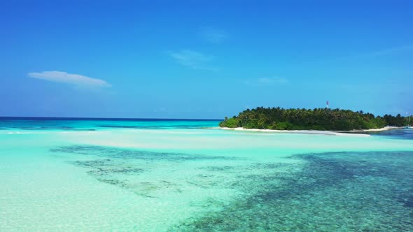 Aerial drone view texture of idyllic island beach holiday by aqua blue ocean with white sand backgro