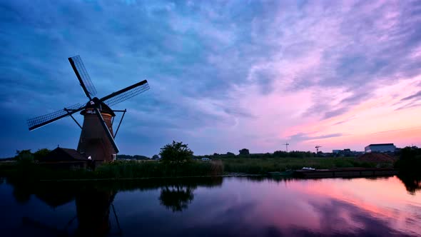 Windmills at Kinderdijk in Holland on Sunset in Netherlands