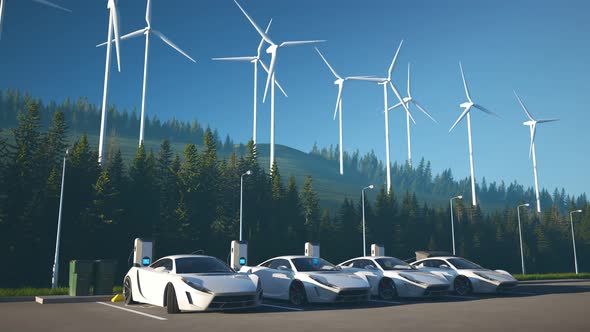 Electric cars connected to the charging station. Vehicles using renewable energy