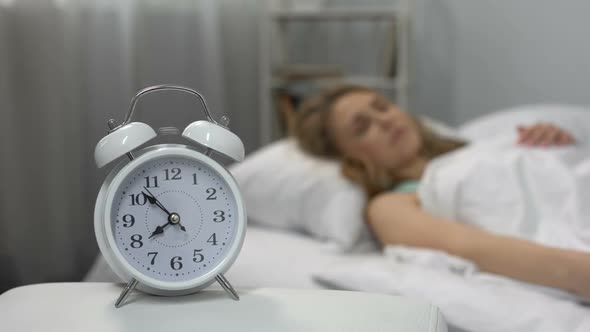 Lady Throwing Pillow at Ringing Alarm Clock, Sleep Deprivation, Morning Stress