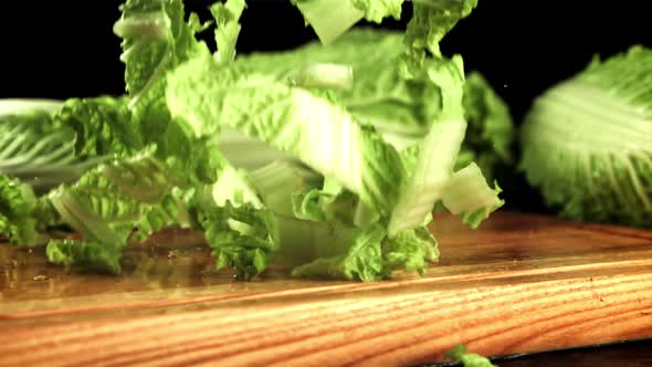 Sliced Beijing Cabbage Falls on a Cutting Board