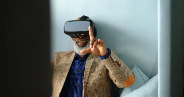 Senior businessman experiencing VR headset 