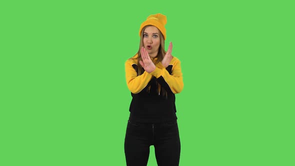 Modern Girl in Yellow Hat Strictly Gesturing with Hands Crossed Making X Shape Meaning Denial Saying