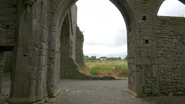 Arched door and stone walls