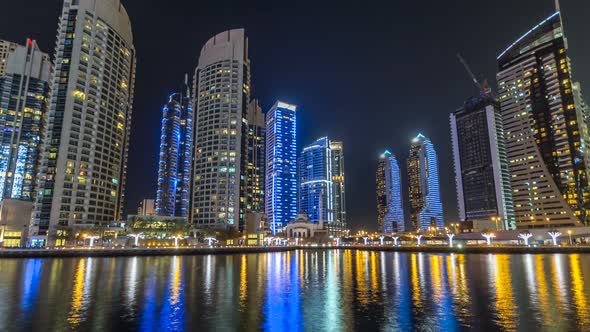 View of Dubai Marina Towers and Canal in Dubai Night Timelapse Hyperlapse