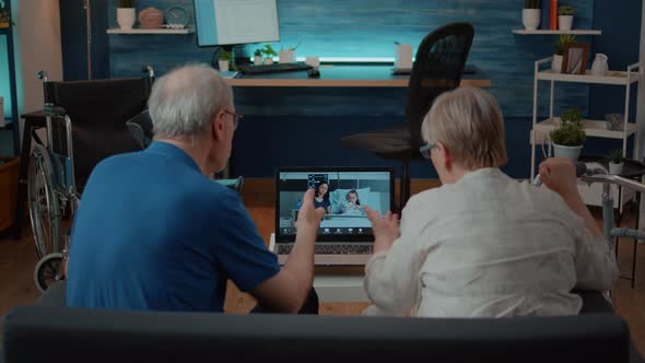 Retired People Attending Video Call Meeting with Relatives in Hospital