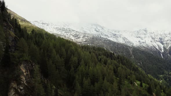 Panoramic View of a Picturesque Mountain Valley with a Village in a Lowland