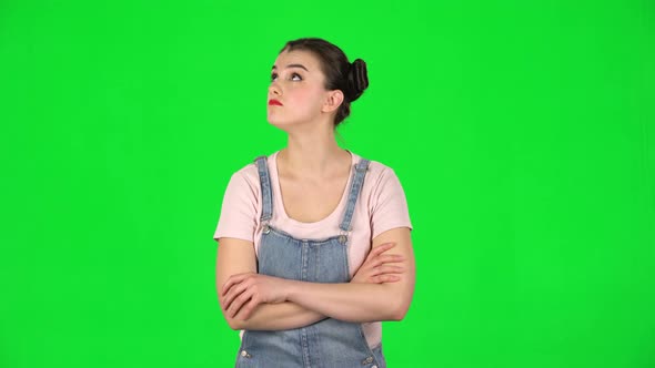 Lovely Girl Listens Carefully To Boring Information and Looks Around on Green Screen