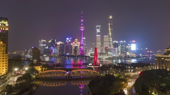 Shanghai Skyline at Night. Lujiazui District, Huangpu River and Waibaidu Bridge. China. Aerial View