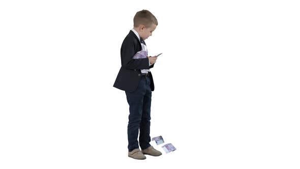 Cute Boy Holding a Bunch of Euros Which Fall From His Hands on White Background.