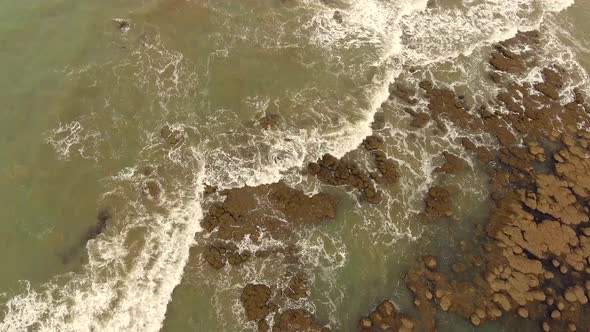 Aerial view of abstract seascape in Cajueiro, Brazil.