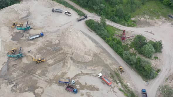 Mining conveyor at sand quarry. Aerial view of mining machinery. Mining industry