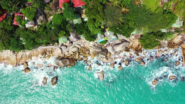 Wide birds eye travel shot of a sunshine white sandy paradise beach and aqua blue ocean background i