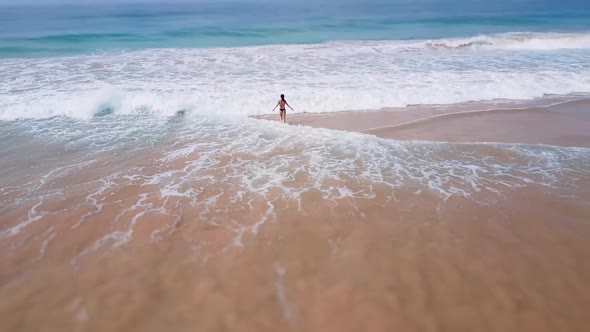 Asian Woman Feet Walking Barefoot Beach at Endless Ocean Seaside Leaving Footprints in Sand