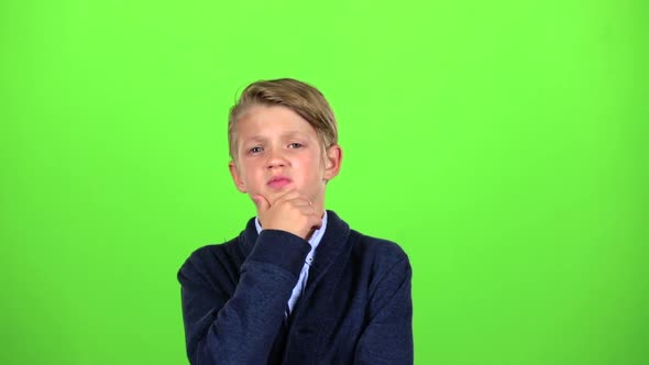 Boy Is Thinking About Important Things. Green Screen. Slow Motion
