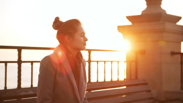 Young Woman Enjoying Sunrise in Slowmoton