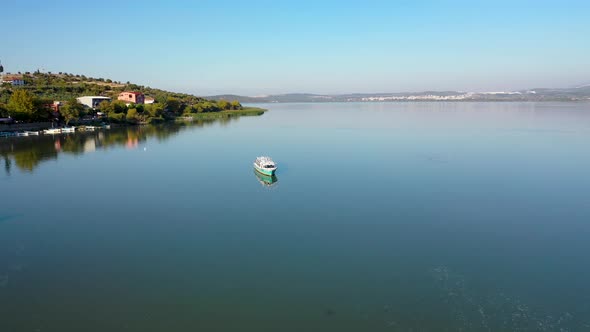 Fishing boat on lake at sunset golyazi, bursa turkey