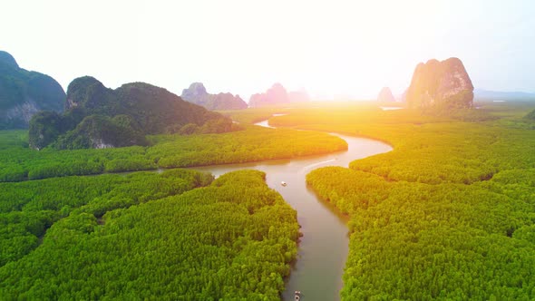 Aerial view from a drone over many islands at Phang Nga Bay during sunset time