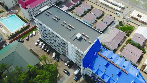 Aerial view on luxury hotel with pool near the sea beach
