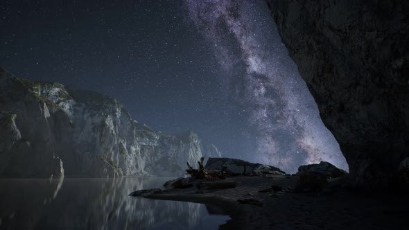 Hyperlapse of Night Starry Sky with Mountain and Ocean Beach in Lofoten Norway