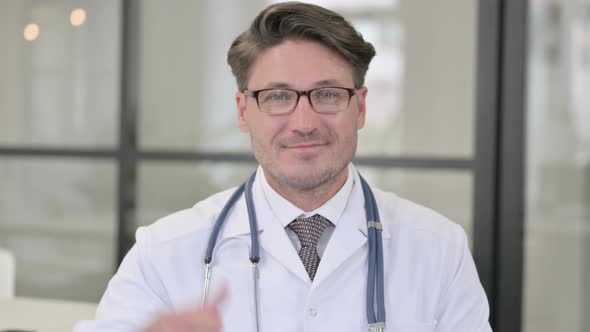 Portrait of Doctor Showing Thumbs Up Sign