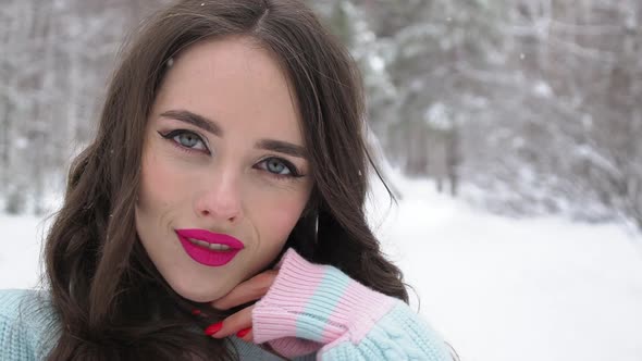 Beautiful Woman in Snowy Countryside