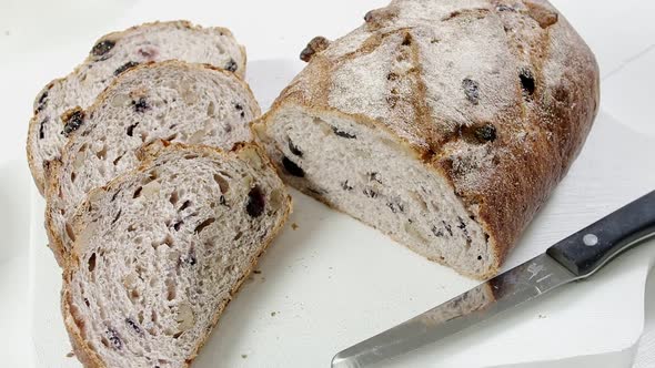 Closeup of Sliced Rye Raisin Bread on the White Cutting Board