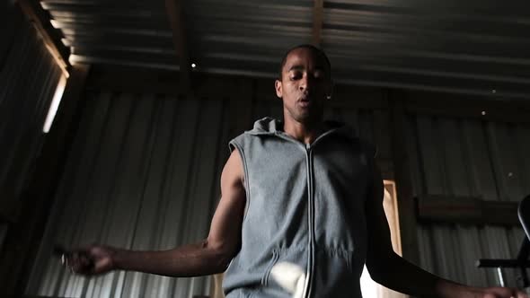 Boxer doing jump ropes in the gym