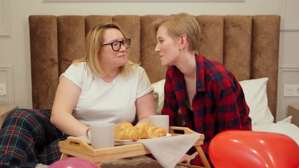 Two Women in Love Have Breakfast in Bed