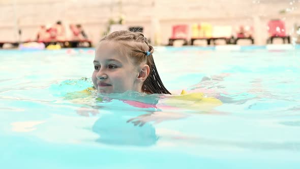 Preteen Girl in Pool